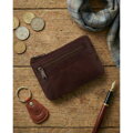 Skórzane etui na klucze w ciemnobrązowym kolorze zamykane suwakiem