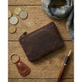 Skórzane etui na klucze w ciemnobrązowym kolorze zamykane suwakiem