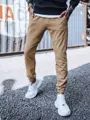 Moderné jogger tepláky vo farbe camel.