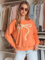 Oranžová dámska mikina SOFTTIE oversize s potlačou mašle BY1378