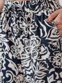 Dámske nohavice materiálové s voľne splývavým strihom TROPICAL SUN tmavomodré UY2632
