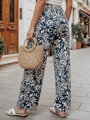 Dámske nohavice materiálové s voľne splývavým strihom TROPICAL SUN tmavomodré UY2632