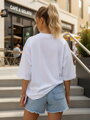 Dámske bavlnené oversize tričko s moderným nápisom biele – Dstreet NX9004RY